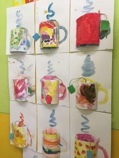 art work displayed on the wall with coffee mugs and other things drawn by children