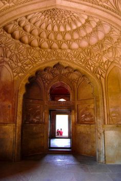 the entrance to an ornately carved building in india - stock photo