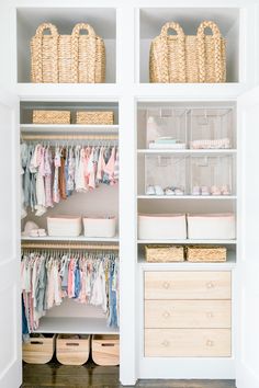 an organized closet with baby clothes and baskets