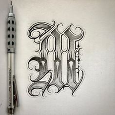 a drawing of the word art on paper with a pen and marker next to it