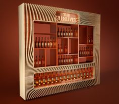 a wooden shelf with bottles on it and lights in the bottom half, behind which is a red wall