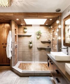 a bathroom with two sinks and a shower