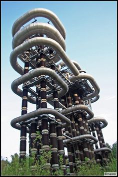 a very tall structure made out of pipes