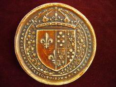 a gold plate with a coat of arms on it