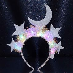 PRICES MAY VARY. Light up headpiece is made of moon,stars,led lights and white hair hoop.Glitter fabric and adjustable colored lights add an element of sparkle and magic to your look. Led celestial headband has three colors to choose from: silver, gold and gold with silver. Each color adds a unique charm, giving you the freedom to match it with your personal style and outfits. Glow moon hair band size is suitable for most women and girls. The anti-slip design will make it more comfortable for yo Glow Hair, Headband Crafts, Whimsical Accessories, Party Hair Accessories, Star Headband, Star Hair, Body Glitter, Glitter Stars, Headband Styles