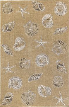 a beige rug with shells and starfishs on it