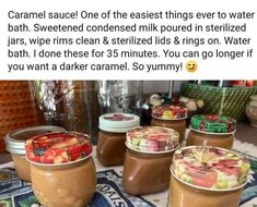 some jars filled with different kinds of food on top of a table next to each other