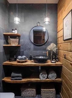 a bathroom with wooden shelves and gray walls