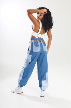 "Best believe your the baddest chic on the block rocking these Joggers. Crafted with Denim and designed with raw patchwork on the legs, exposed hip line because who doesn't want to show a little skin? And last but not least, unique back pockets which adds a little spice to the look. Magnifique! -All of our garments are individually handmade and made to order. *Garments are fit to size *If your measurements for your size is a little different than the standard sizing, we can make a custom sized g High Rise Cotton Jeans Hip Hop Style, Hip Hop Cargo Jeans In Denim Blue For Spring, Hip Hop Denim Blue Cargo Jeans For Spring, Hip Hop High Waist Blue Jeans, Blue Sporty Denim Jeans, Sporty Blue Denim Jeans, Hip Hop Style Cotton Bottoms In Medium Wash, Hip Hop Style Medium Wash Cotton Bottoms, Denim Hip Hop Cargo Pants For Spring