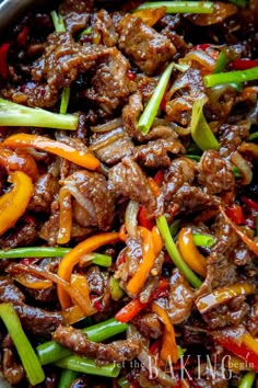 beef and peppers stir fry in a skillet