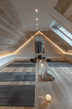 a room with yoga mats and lights in it