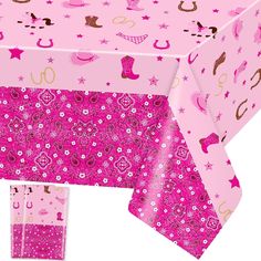 a pink table cloth with cowgirl designs on it