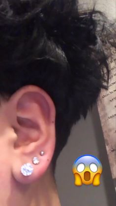 a person with ear piercings on their ears