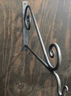 a metal hook on the side of a wooden door