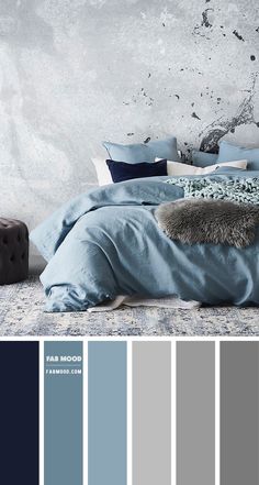 a bedroom with blue and grey colors in the walls, bedding and rugs