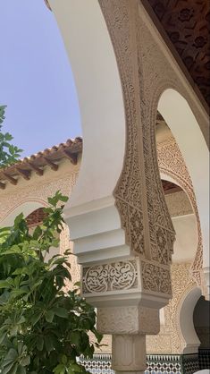 an intricately decorated building with green plants