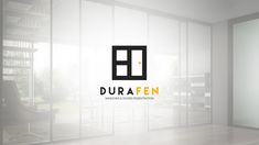 the logo for durafen windows looks like it is in an empty room with glass walls