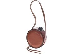 a brown purse with a long strap hanging from it's side, on a white background