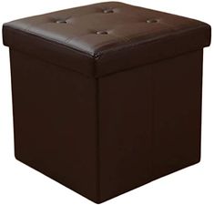 a brown leather ottoman with buttons on the top and bottom, sitting in front of a white background