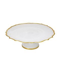 a white and gold platter on a white background