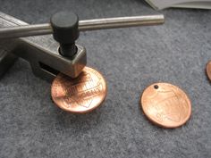 two penny pieces sitting on top of a machine