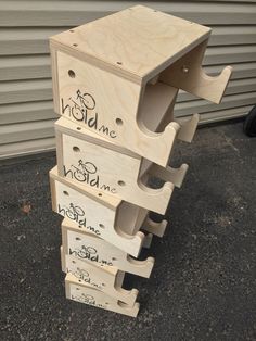 a stack of wooden wine crates sitting next to a garage