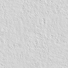 a white stucco wall textured with cement