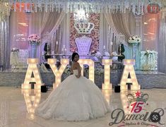 a woman in a wedding dress standing next to the word'ayia '