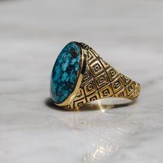 Classic style Indonesian ring in brass with an oval Chrysocolla stone. This vibrant blue ring looks great on any finger for both women and men. Chrysocolla is a copper stone that resonates with the vibrations of the Earth and helps clear blockages from the throat chakra. It promotes clear communication and the courage to express oneself. Available in Sterling Silver https://etsy.me/2kUGlpI Ring Size Available in all sizes. Please be sure to find your exact ring size for the finger you want befor Adjustable Oval Jewelry With Patina, Classic Gold Turquoise Ring With Round Shape, Gold Oval Turquoise Ring Gift, Adjustable Gold Oval Turquoise Ring, Adjustable Gold Turquoise Ring With Oval Shape, Oval Gold Turquoise Ring Gift, Gold Rings With Antique Finish, Gold Oval Turquoise Ring For Anniversary, Oval Etched Brass Jewelry