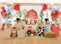 an image of a birthday party with farm animals and balloons on the wall behind it