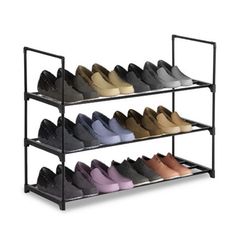 four tiered shoe rack with multiple pairs of shoes on each shelf in different colors