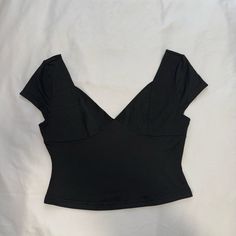 Black Wide V Neck Top Really Pretty Design And Stitching Modern Wide Neck Top Baby Tee Deep V Neck Black Crop Top Black Off The Shoulder Top Black Wide Neckline Top Black Stretch V-neck Crop Top, Black V-neck Top For Night Out, Solid V-neck Crop Top For Party, Trendy V-neck Crop Top For Evening, Chic Black V-neck Crop Top, Black Short Sleeve Crop Top For Evening, Chic Black Fitted Crop Top, Casual Evening Crop Top, Black Fitted Crop Top For Summer