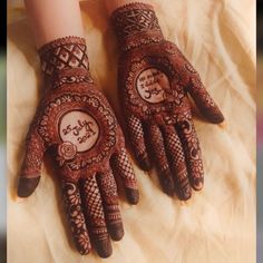 two hands with henna designs on them and the words love you written on it