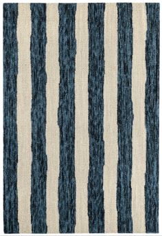 a blue and white rug with stripes on it