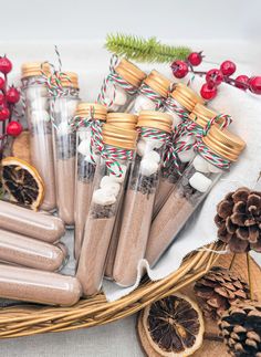 a basket filled with lots of different types of cinnamons next to some pine cones