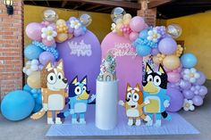 balloons and decorations for a birthday party with cartoon characters on the front, along with an animal theme