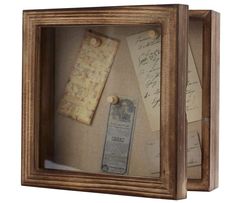 a wooden frame with some writing on it and a bookmark in the bottom right corner