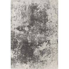 a gray and white area rug with an abstract design in the middle, on a white background