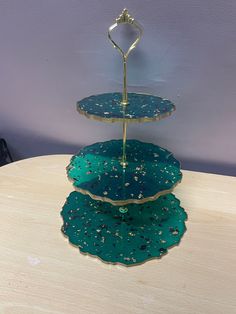 three tiered serving tray on top of a table