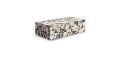 a white and black marble block on a white background