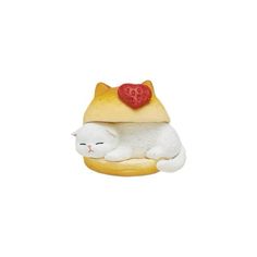 a white cat laying on top of a hamburger with a strawberry on it's head