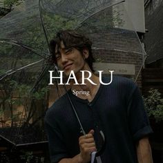 a man holding an umbrella in front of him with the words haru on it