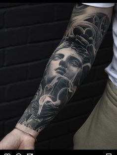 a man with a tattoo on his arm