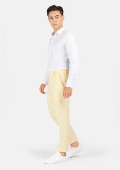 Crafted with a vibrant, cream yellow stretch cotton, these custom made pants are uniquely stylish and supremely comfortable, and will become a go to favorite when you're looking to stand out. Slim Fit Cotton Chinos For Summer, Slim Fit Tapered Leg Chinos For Summer, Slim Fit Tapered Leg Summer Chinos, Summer Slim Fit Tapered Leg Chinos, Summer Slim Fit Straight Chinos, Summer Slim Fit Cotton Chinos, White Cotton Dress Trousers, Slim Fit Cotton Pants For Summer, Fitted Tapered Leg Summer Chinos