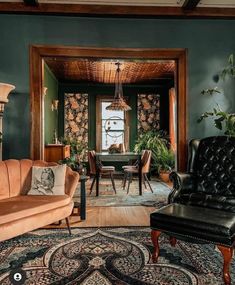 a living room filled with furniture next to a dining room table and chairs on top of a rug