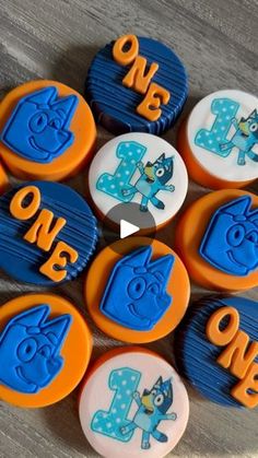 some blue and orange cupcakes with numbers on them