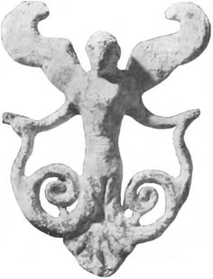 an ancient statue with spiral designs on it