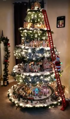 a christmas tree with lights and a ladder