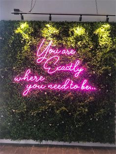 a neon sign that says you are easily where you need to be on the wall