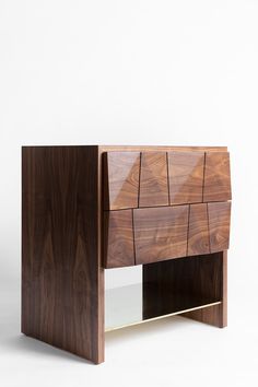 the sideboard is made out of wood and has an unusual pattern on it's sides